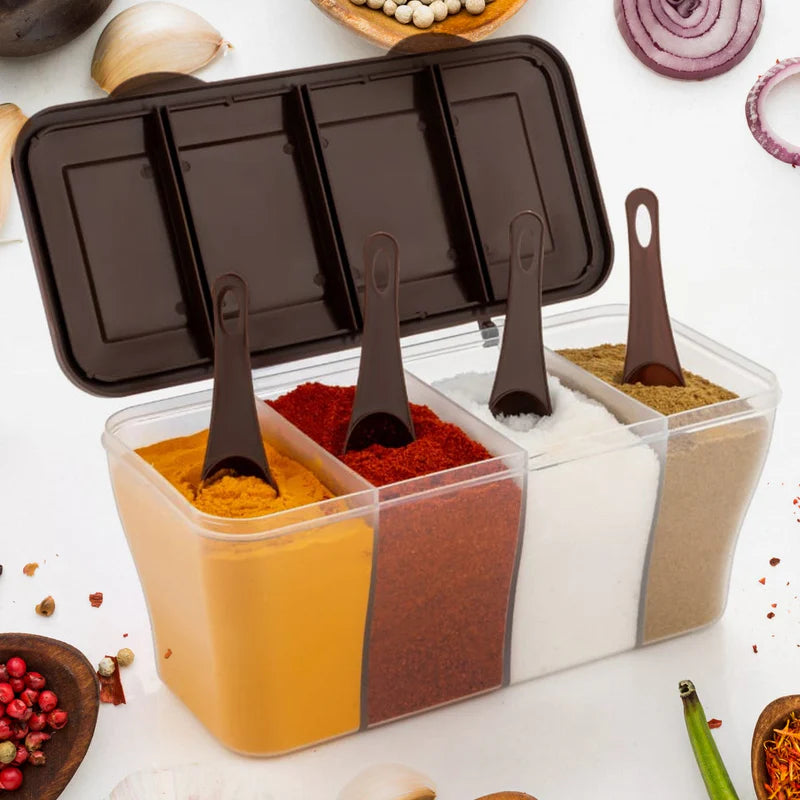 Spice container with compartments filled with different spices on a white surface with various spices around.