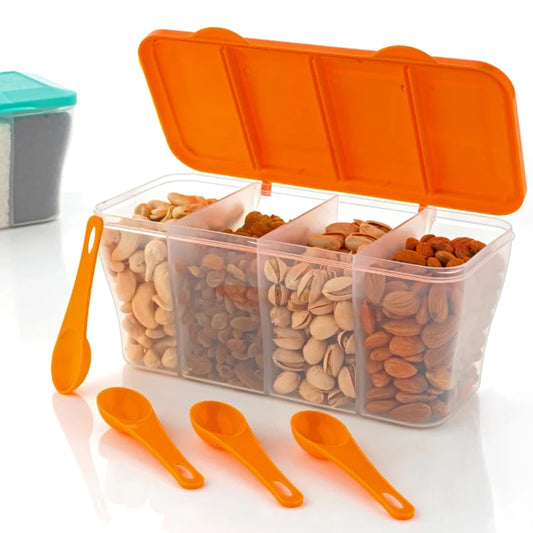 Transparent container with compartments filled with nuts and seeds, orange lid and spoons on a white background