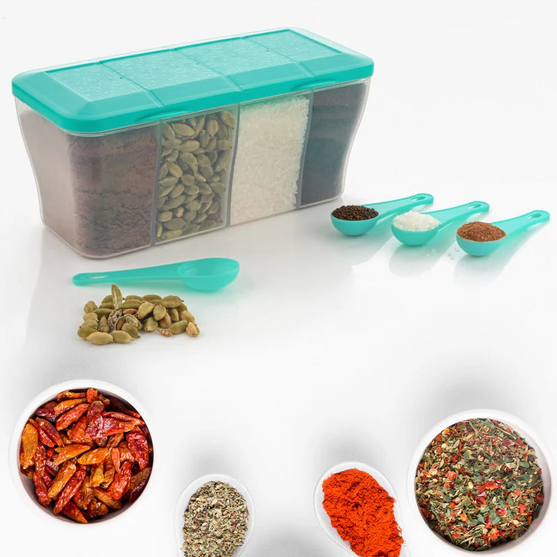Spice container with teal lid and compartments, surrounded by various spices and small green spoons on a white background.