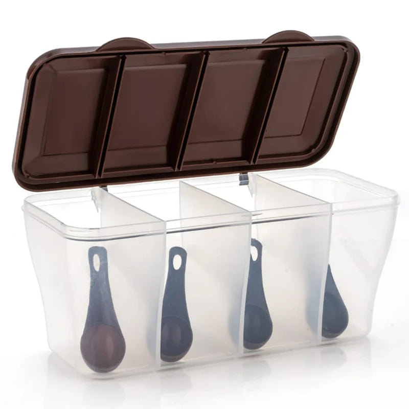 Clear container with brown lid and four black spoons inside on a white background