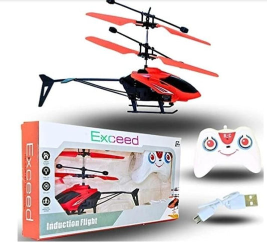 Red and black Exceed RC helicopter with packaging, remote control, and USB cable on a white background