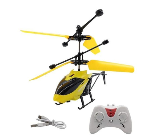 Yellow toy helicopter with remote control and charging cable on a white background